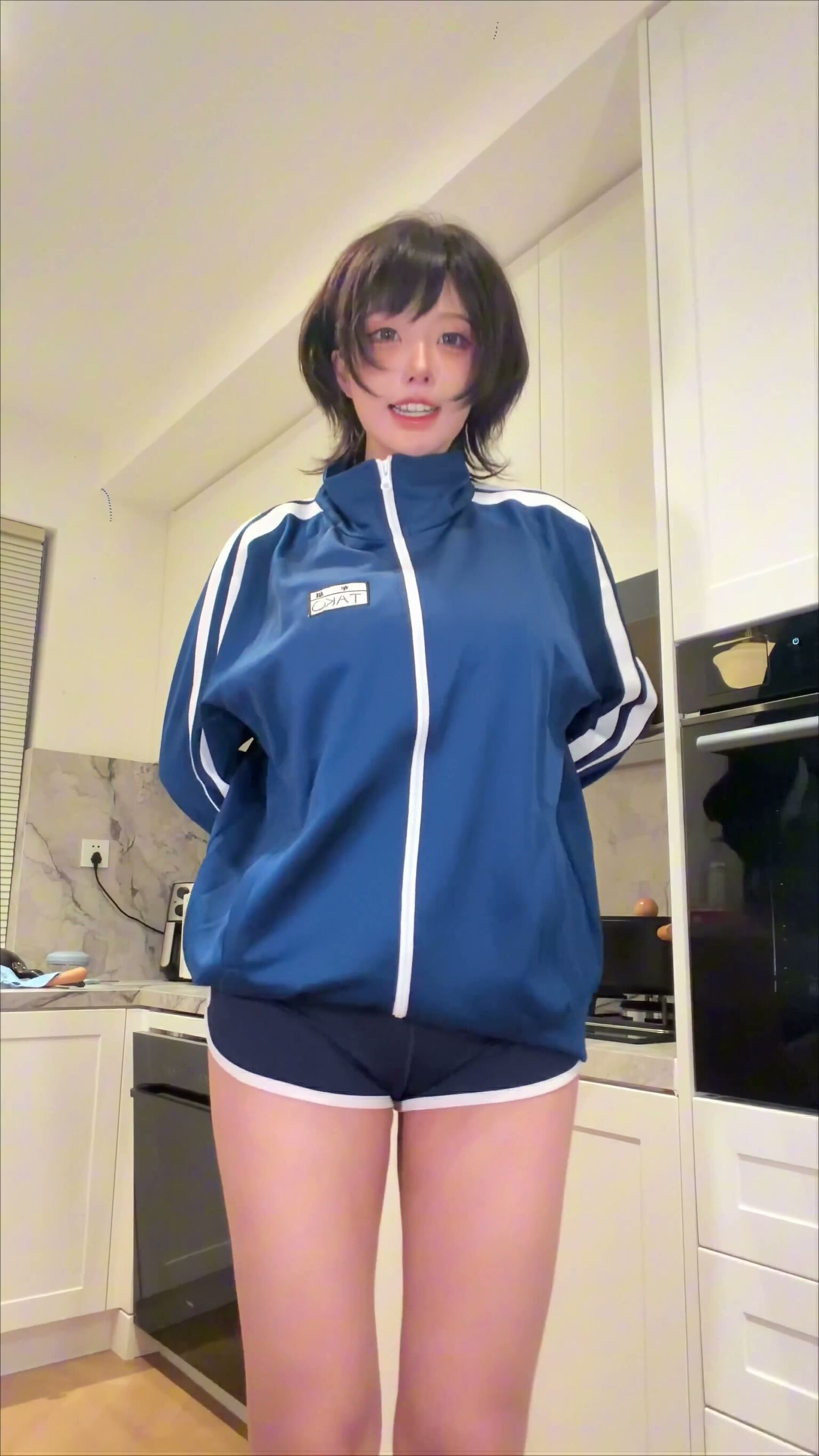 Short-haired Asian Babe Teases in Kitchen