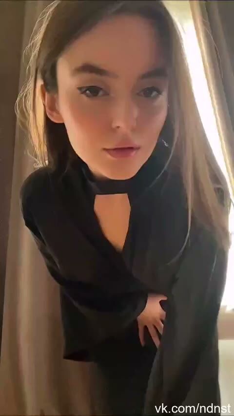 Slim Brunette Beauty in Black Cutout Dress