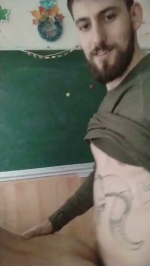 Tattooed Bearded Arab Guy Shirtless in Classroom