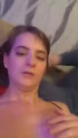 Amateur Brunette Teases Her Natural Boobs in Bed