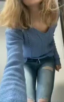 Busty Blonde Teen Shows Cleavage in Ripped Jeans