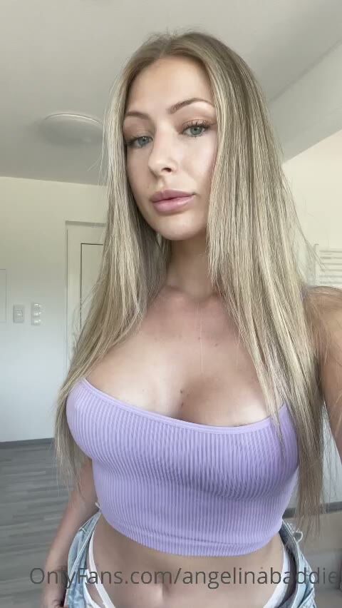 Busty Blonde OnlyFans Model Teases in Purple Crop Top
