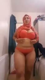 Curvy Hijabi BBW MILF in Orange Bikini Poses