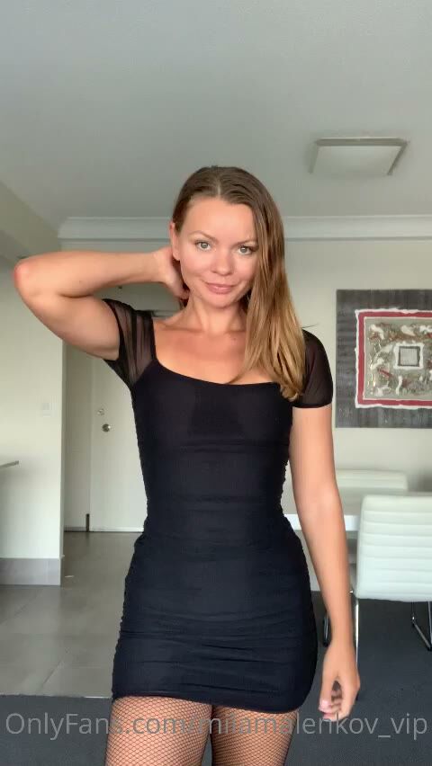Brunette MILF in Tight Black Mini Dress