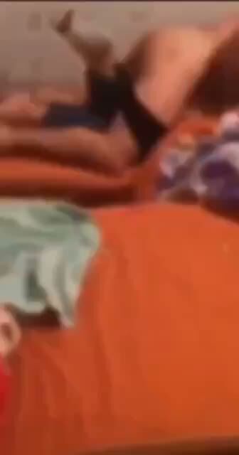 Amateur Couple Fucking on Orange Bed Sheets