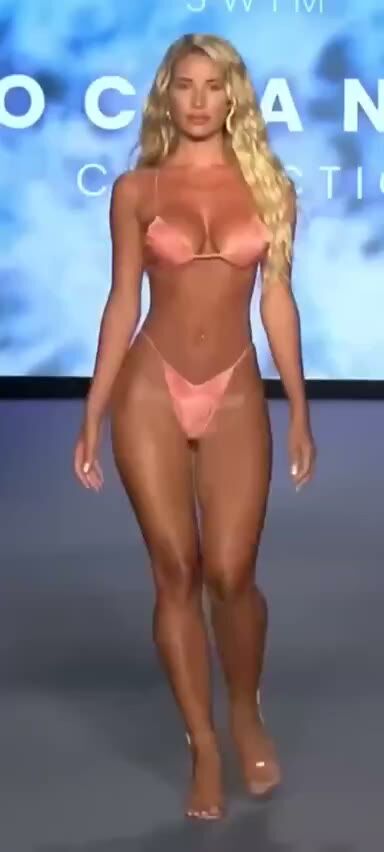Busty Blonde Model Struts in Pink Bikini