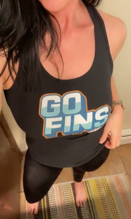 Busty Tattooed MILF Flashes Big Tits