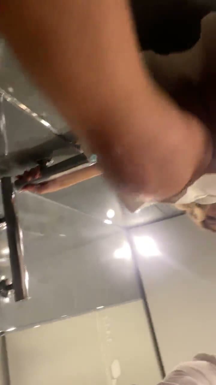 Blonde Man Licks Feet on Bathroom Floor