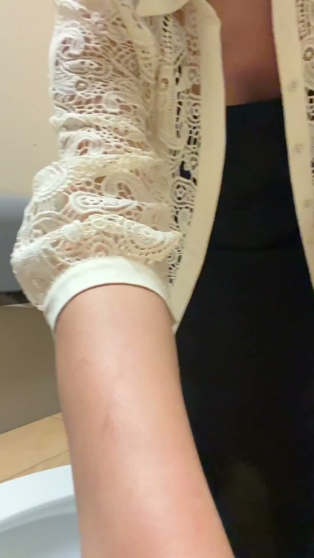 Brunette MILF Spreads Ass in Public Restroom