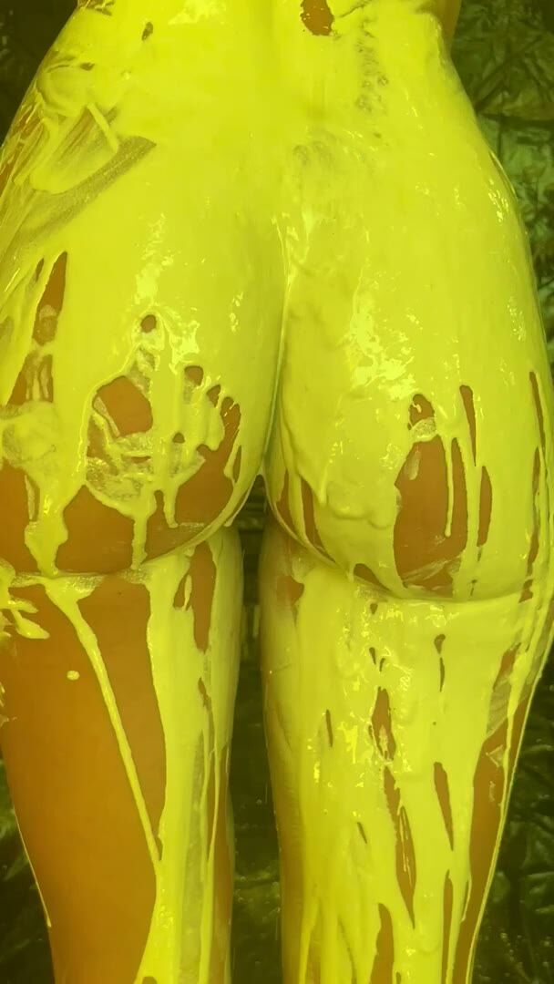 Curvy Ebony Covered in Yellow Paint