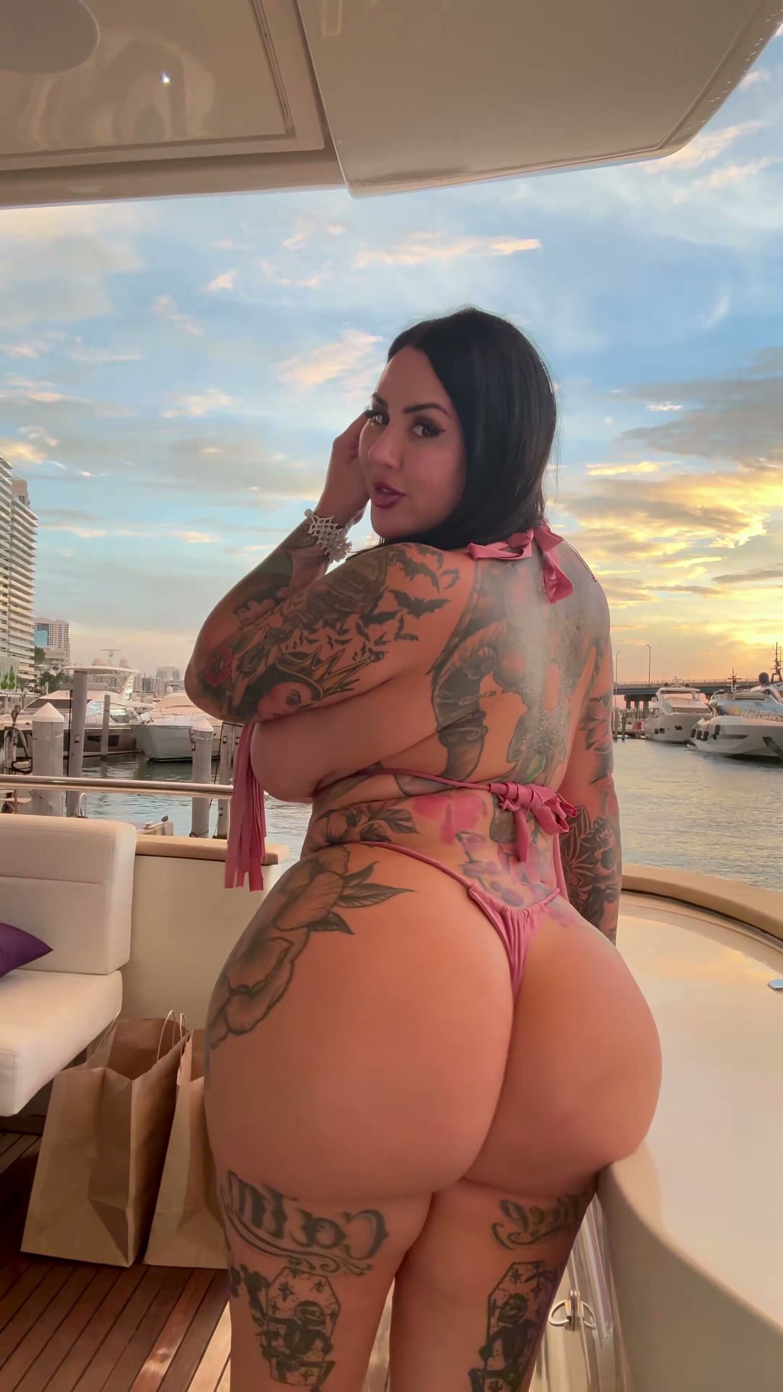 Tattooed Curvy Brunette Shows Big Ass on Yacht