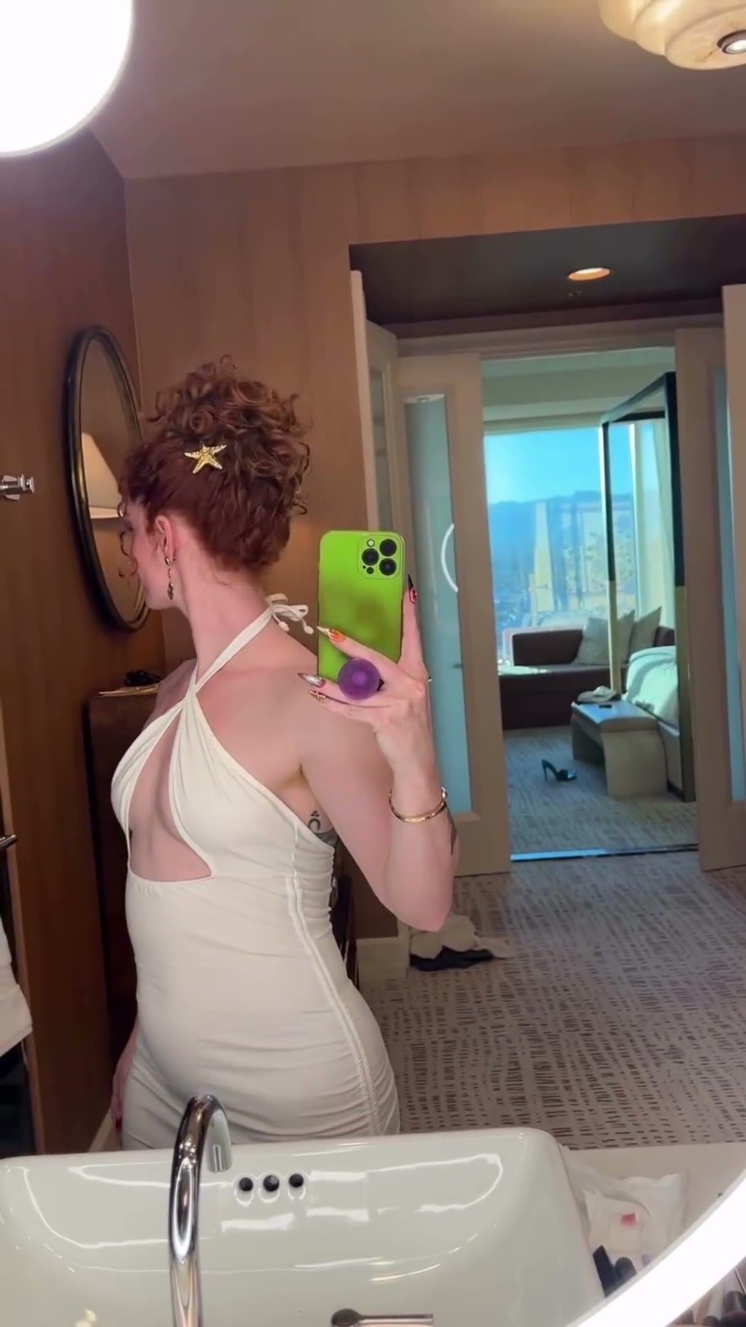 Curvy Redhead Poses in Hotel Bathroom Mirror