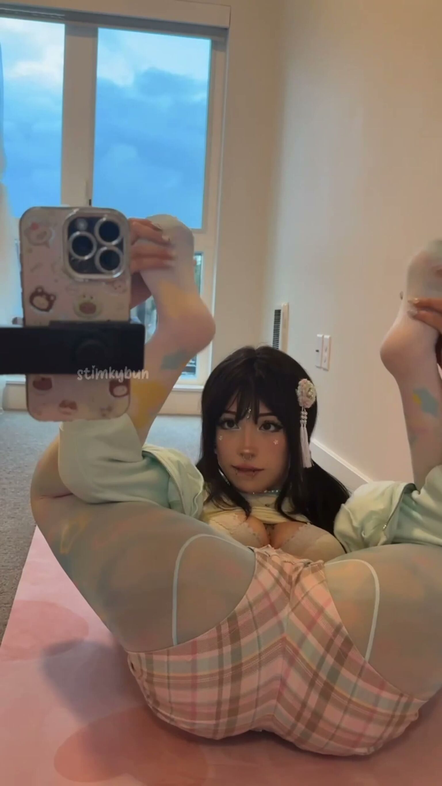 Busty Brunette Teases in Flexible Stocking Pose