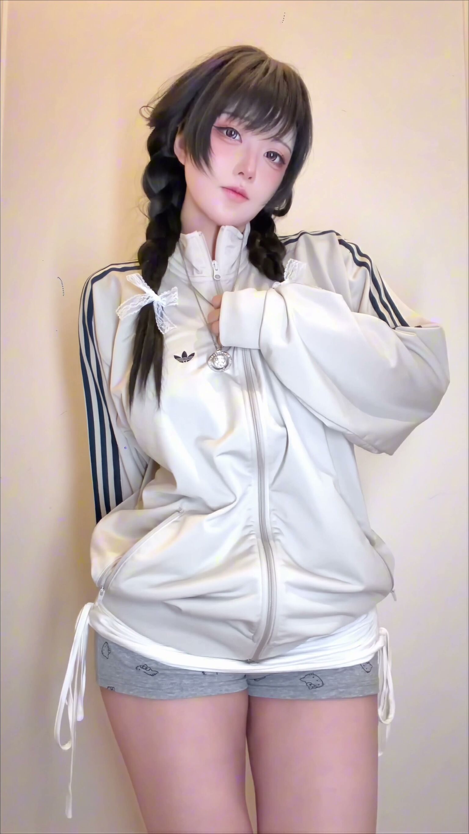 Busty Asian Pigtails Jacket Striptease