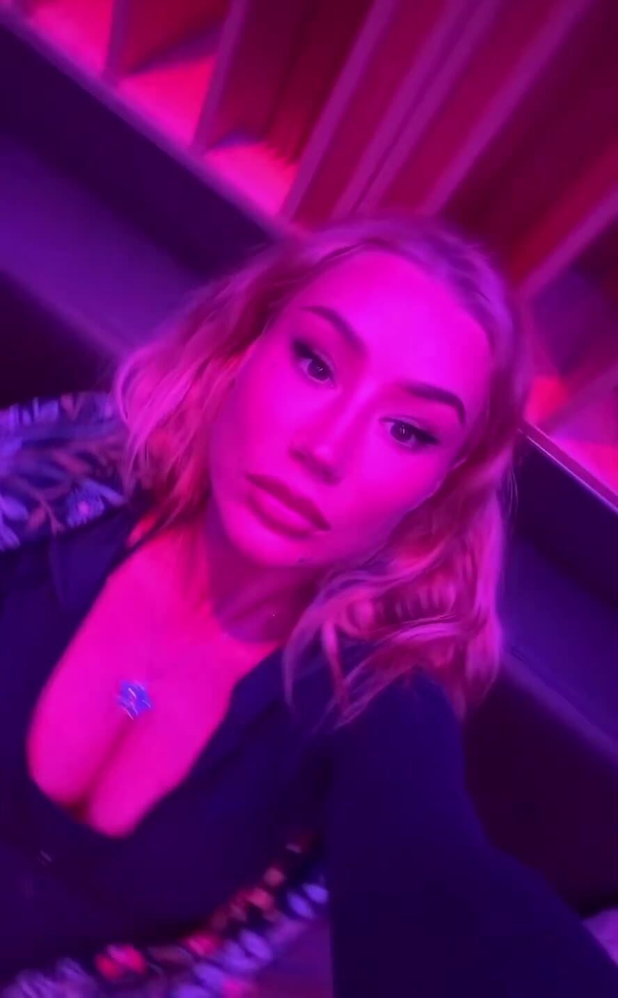 Blonde Babe Teases in Pink Neon Light